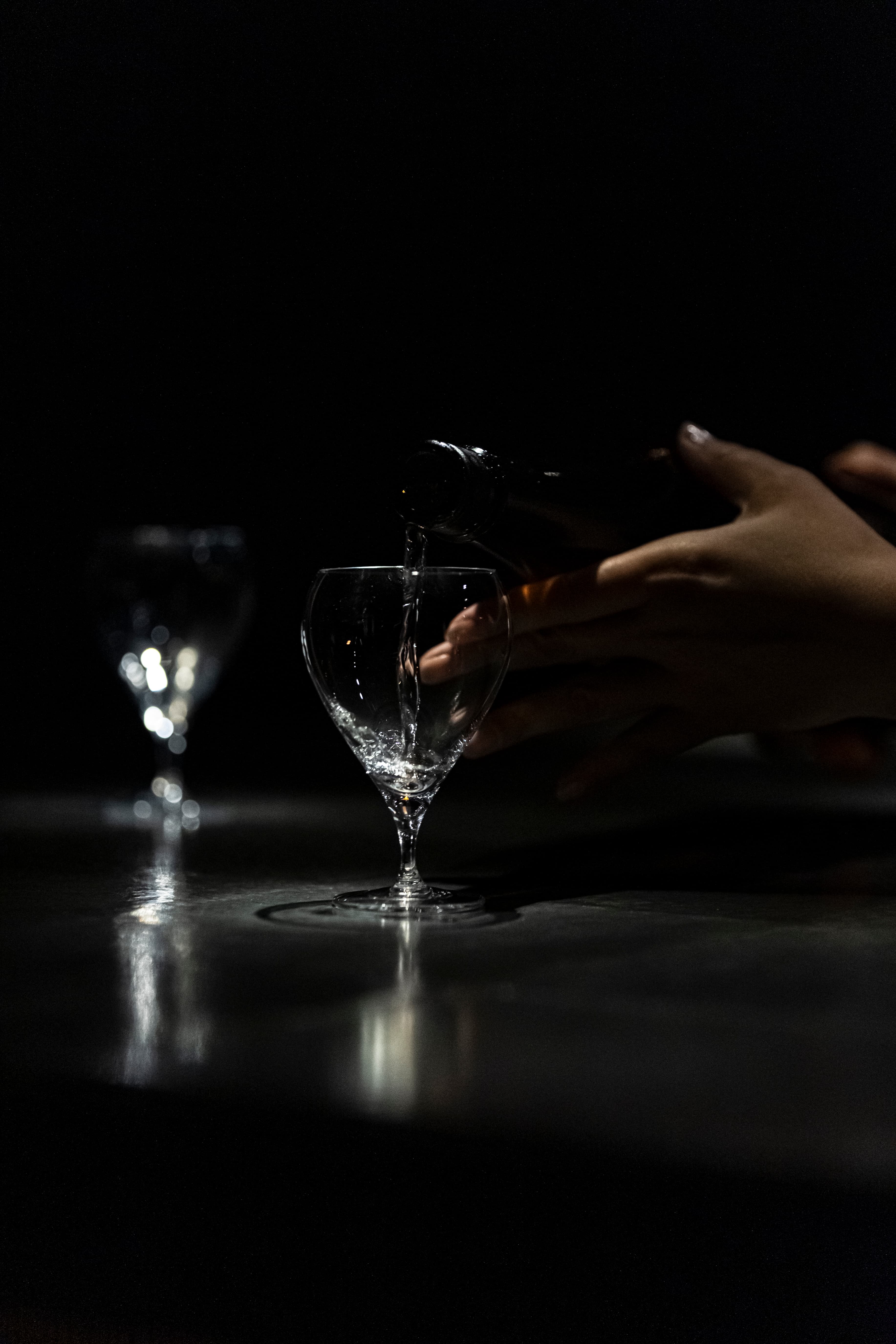 A glass of sake being poured