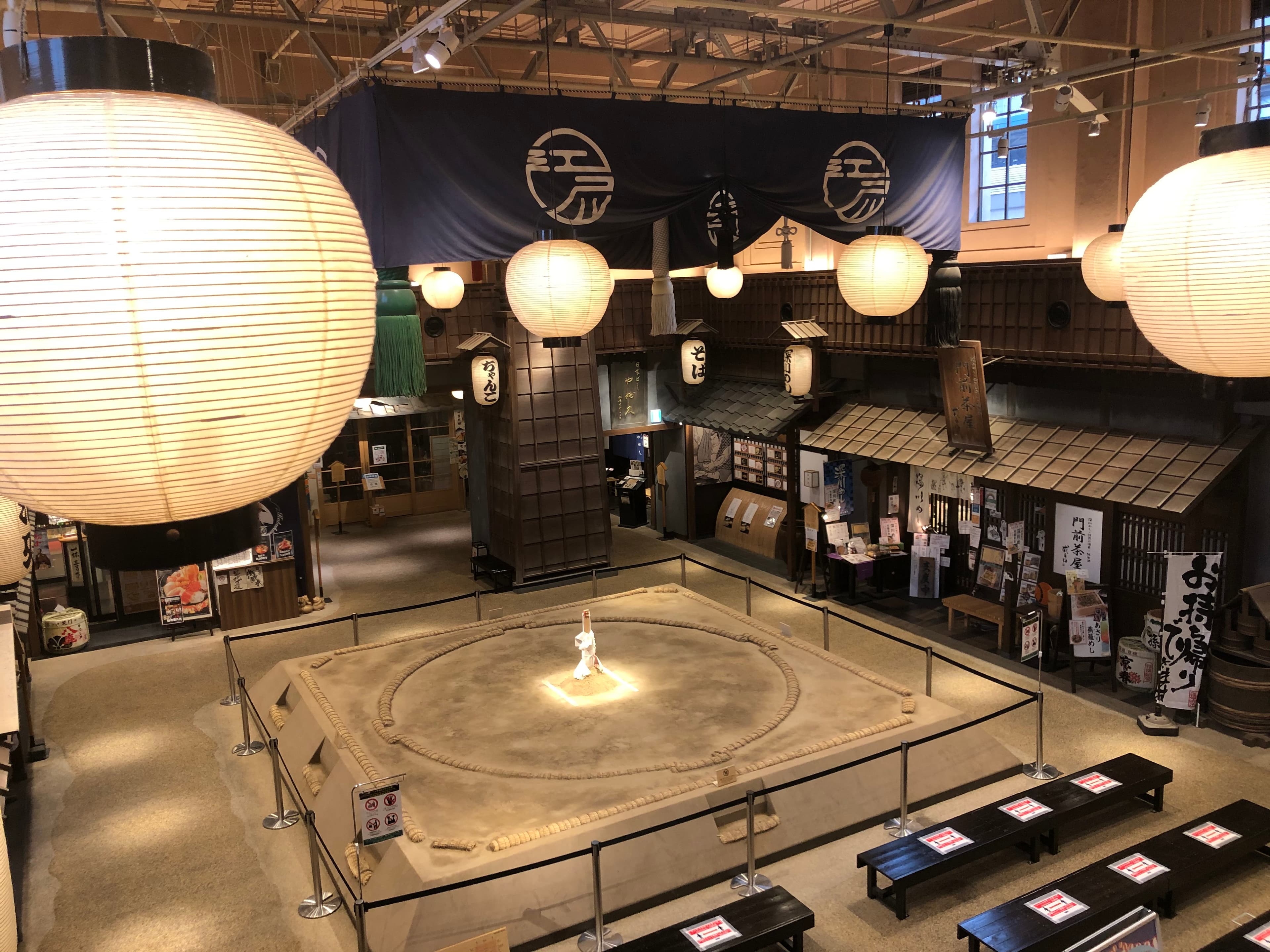 Sumo ring under giant paper lanterns at Ryogoku Edo Noren food hall in Tokyo